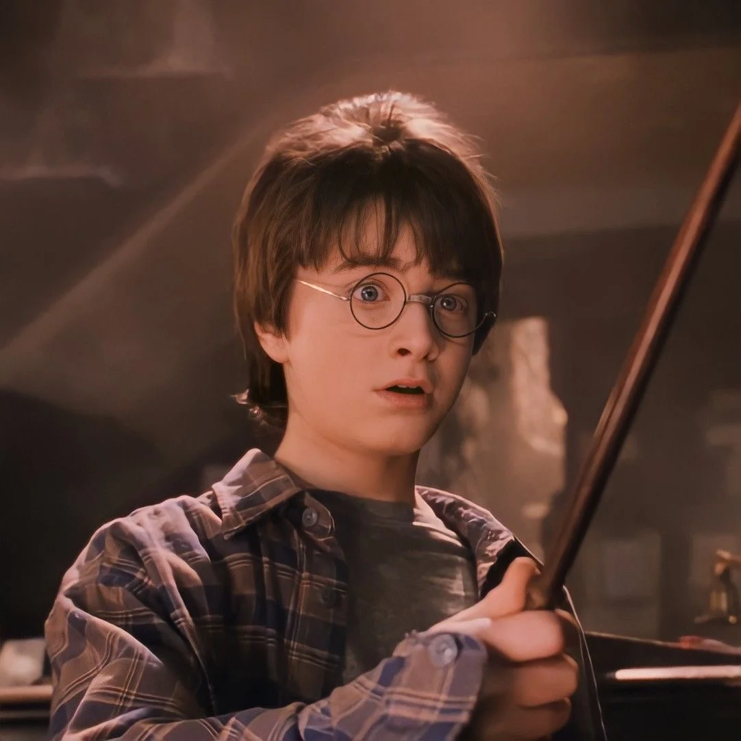 Harry holding his wand for the first time at Ollivanders