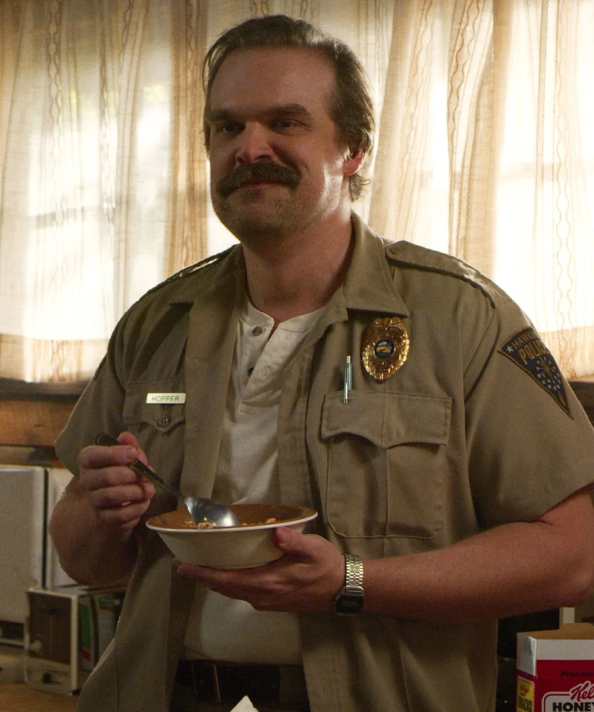 Hopper in uniform holding a bowl of cereal